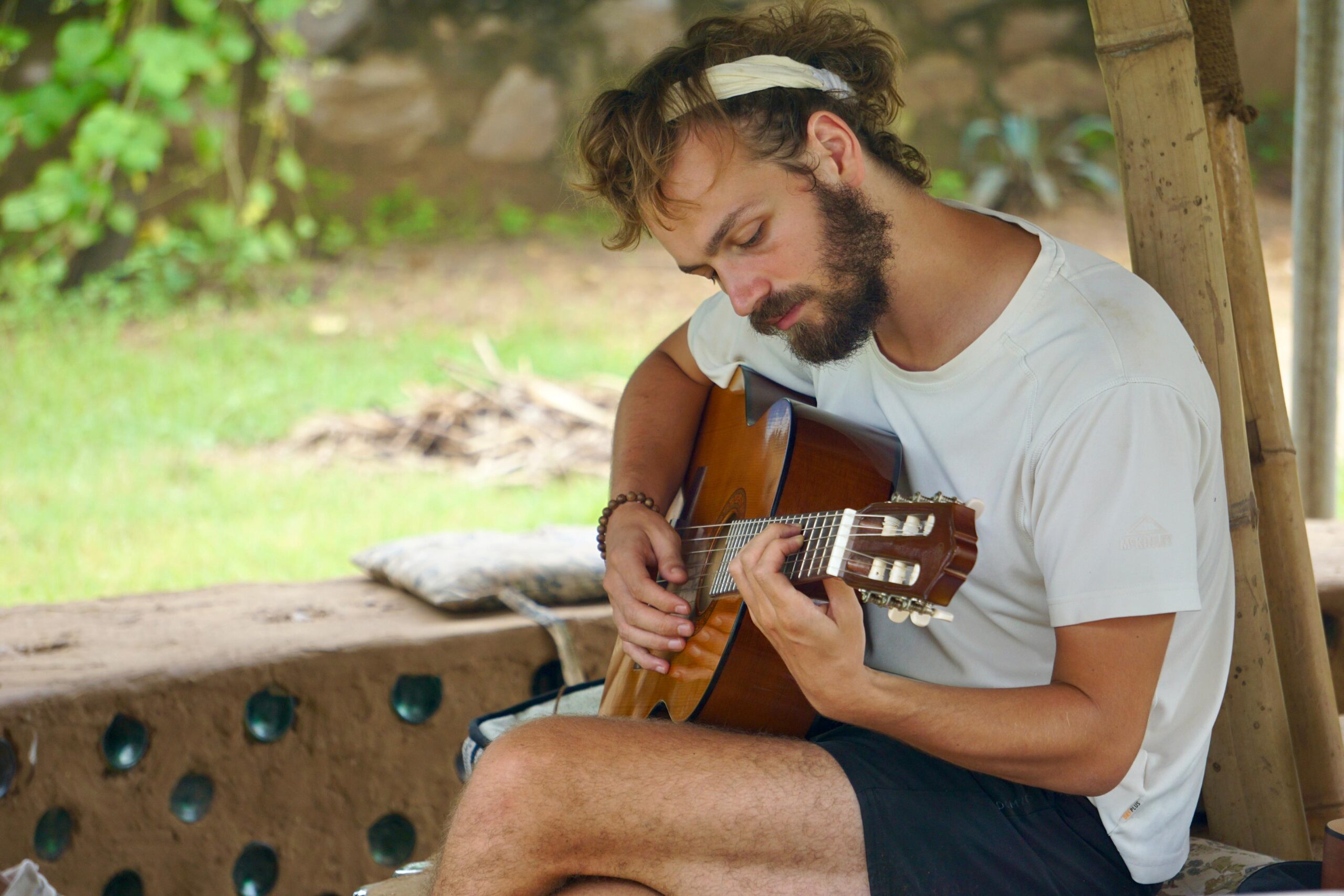 Arthur Playing Guitar at Vinyasa Earth